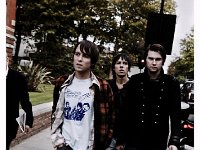 The Cribs  Walking on a street.